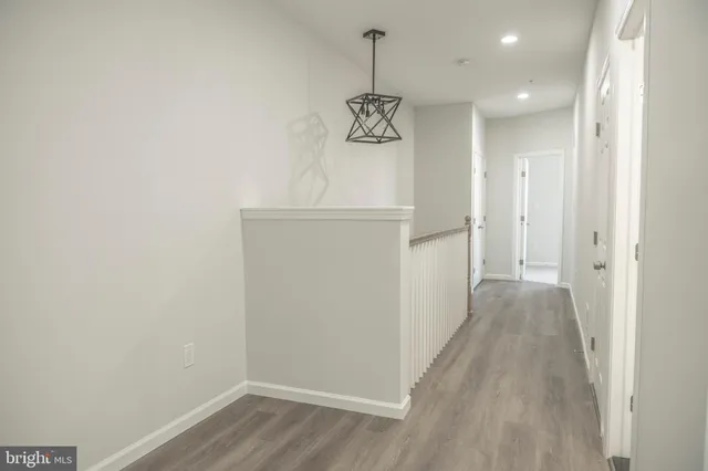 a bathroom with a granite countertop sink a mirror and shower