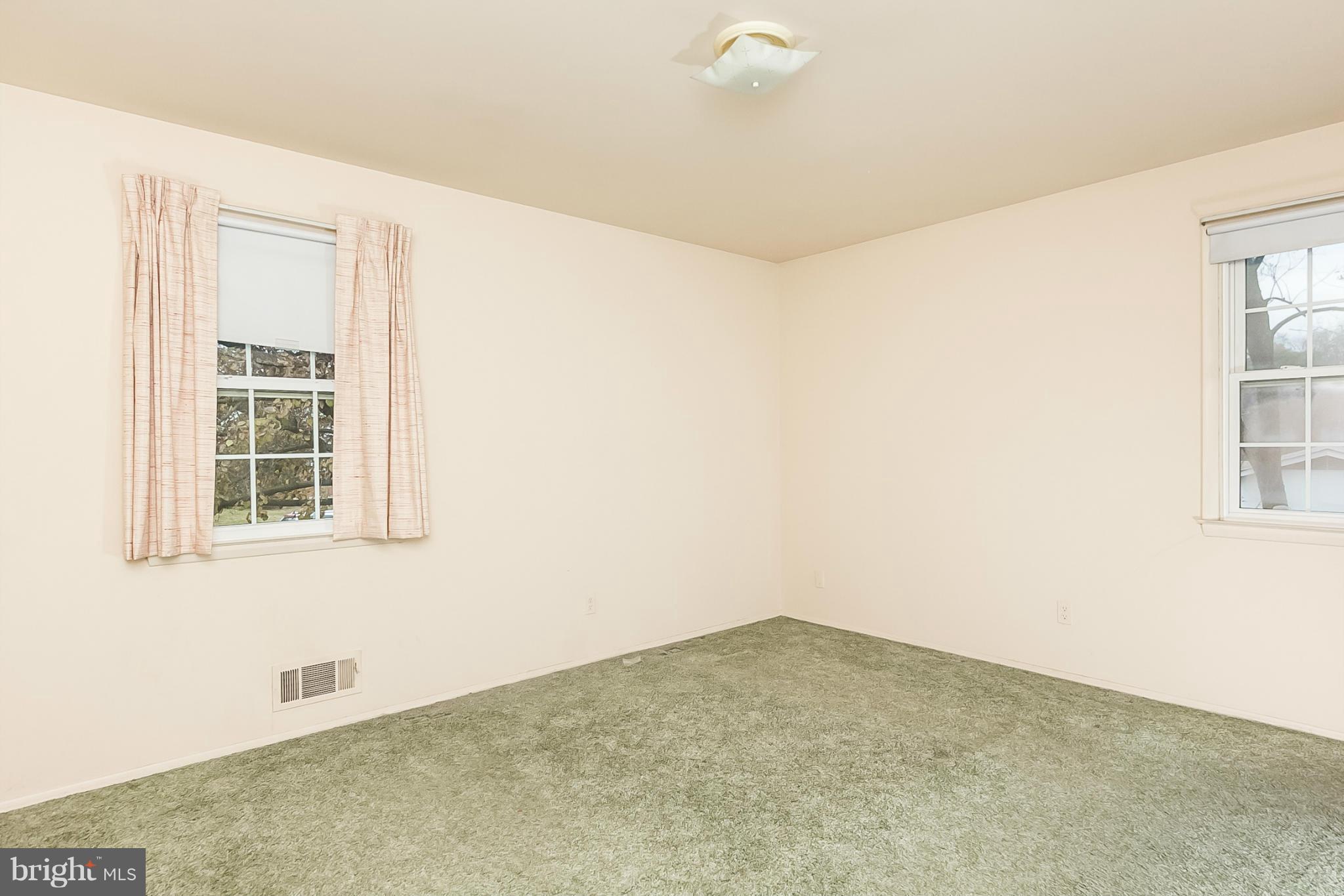 6738 Fordcrest Road Baltimore, MD 21237 - Photo 13 of 28 an empty room with windows