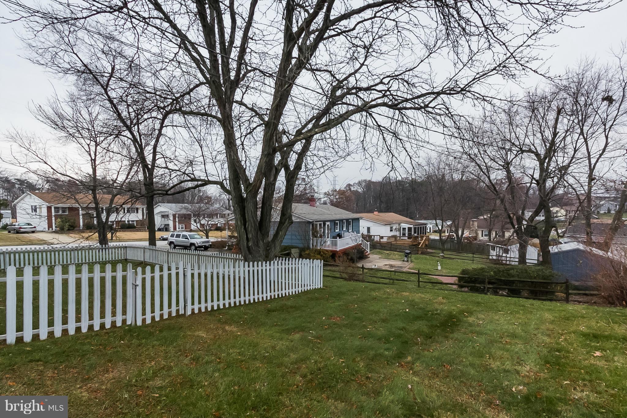 6738 Fordcrest Road Baltimore, MD 21237 - Photo 24 of 28 a view of a bench in the middle of a yard