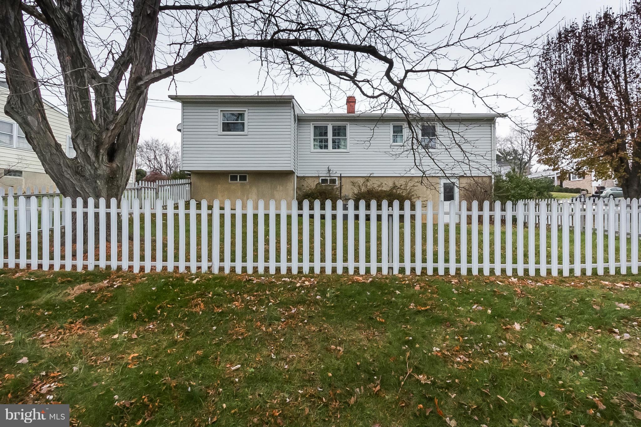 6738 Fordcrest Road Baltimore, MD 21237 - Photo 26 of 28 a front view of a house with a garden