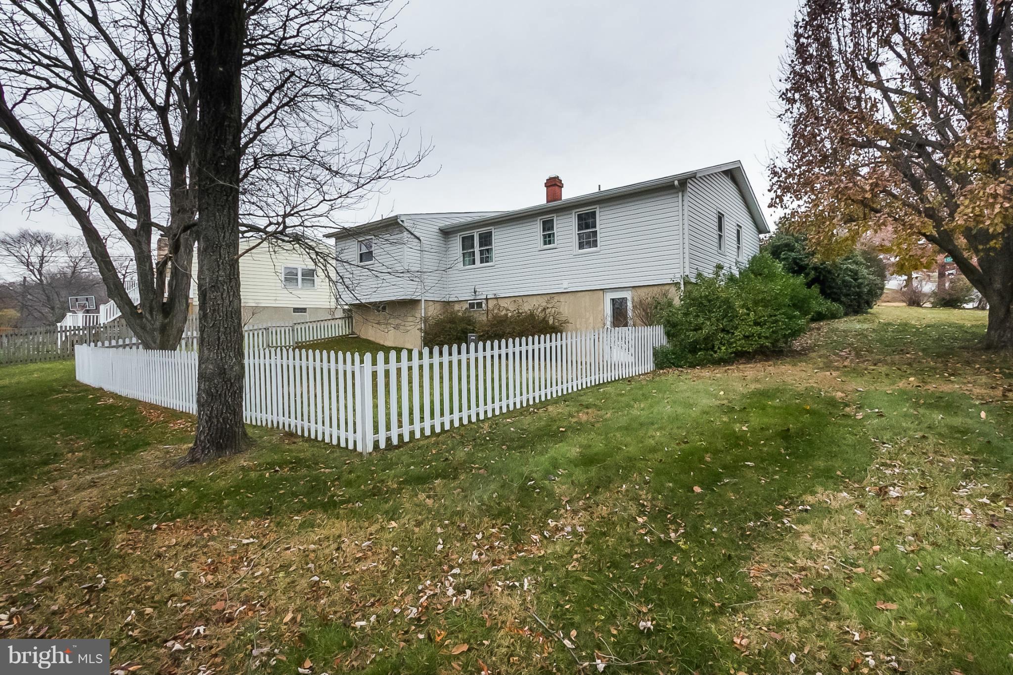 6738 Fordcrest Road Baltimore, MD 21237 - Photo 27 of 28 a view of a house with a yard