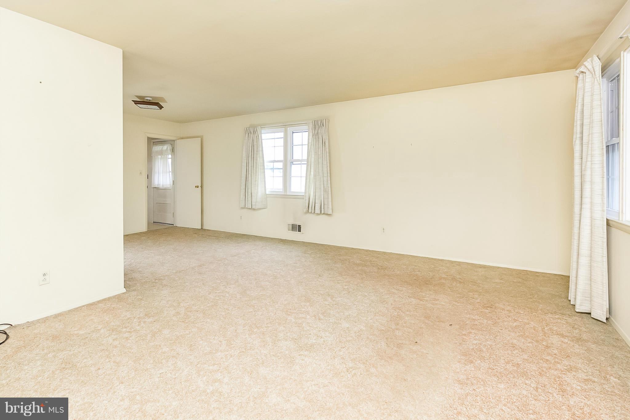 6738 Fordcrest Road Baltimore, MD 21237 - Photo 4 of 28 an empty room with windows and closet