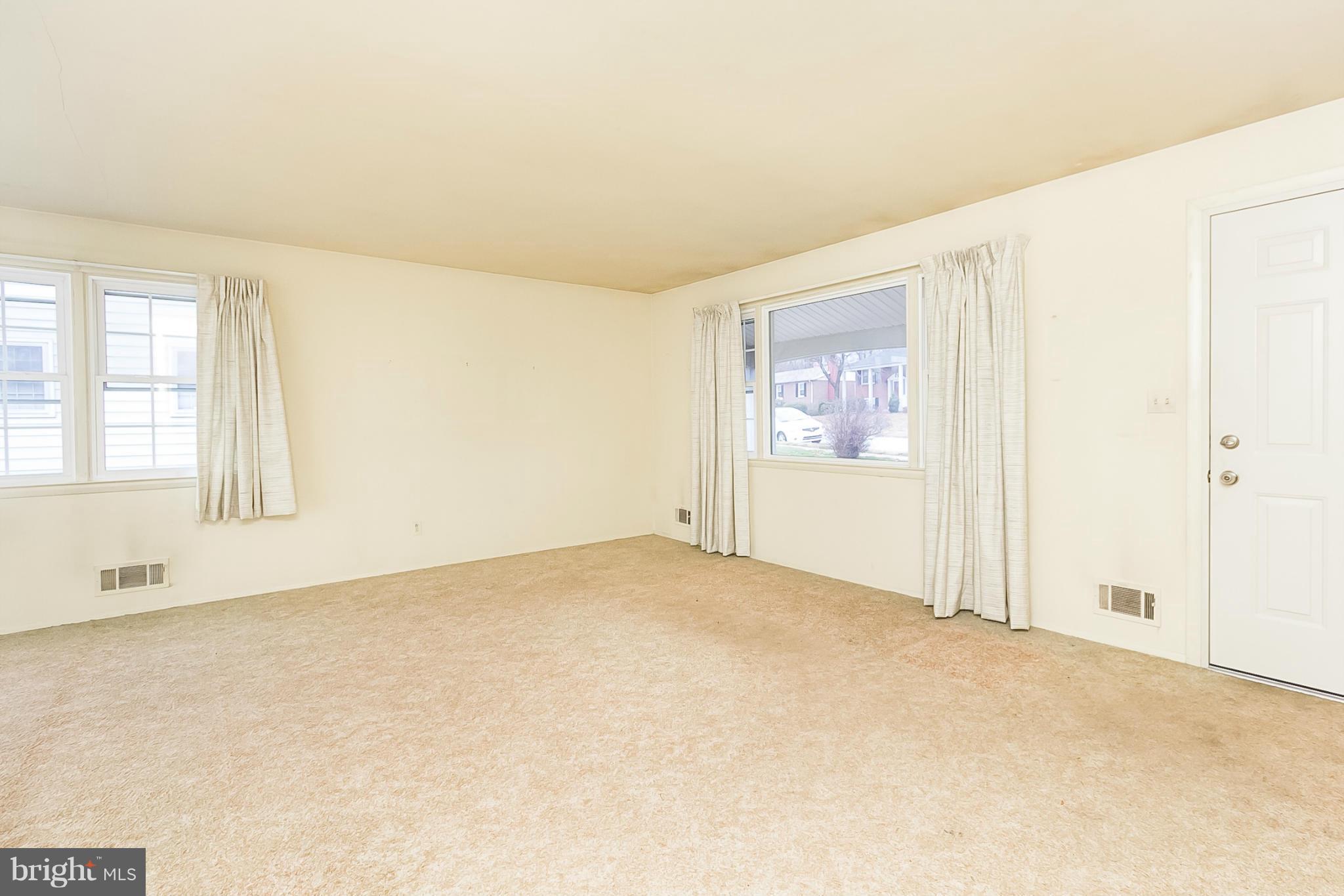 6738 Fordcrest Road Baltimore, MD 21237 - Photo 6 of 28 an empty room with windows