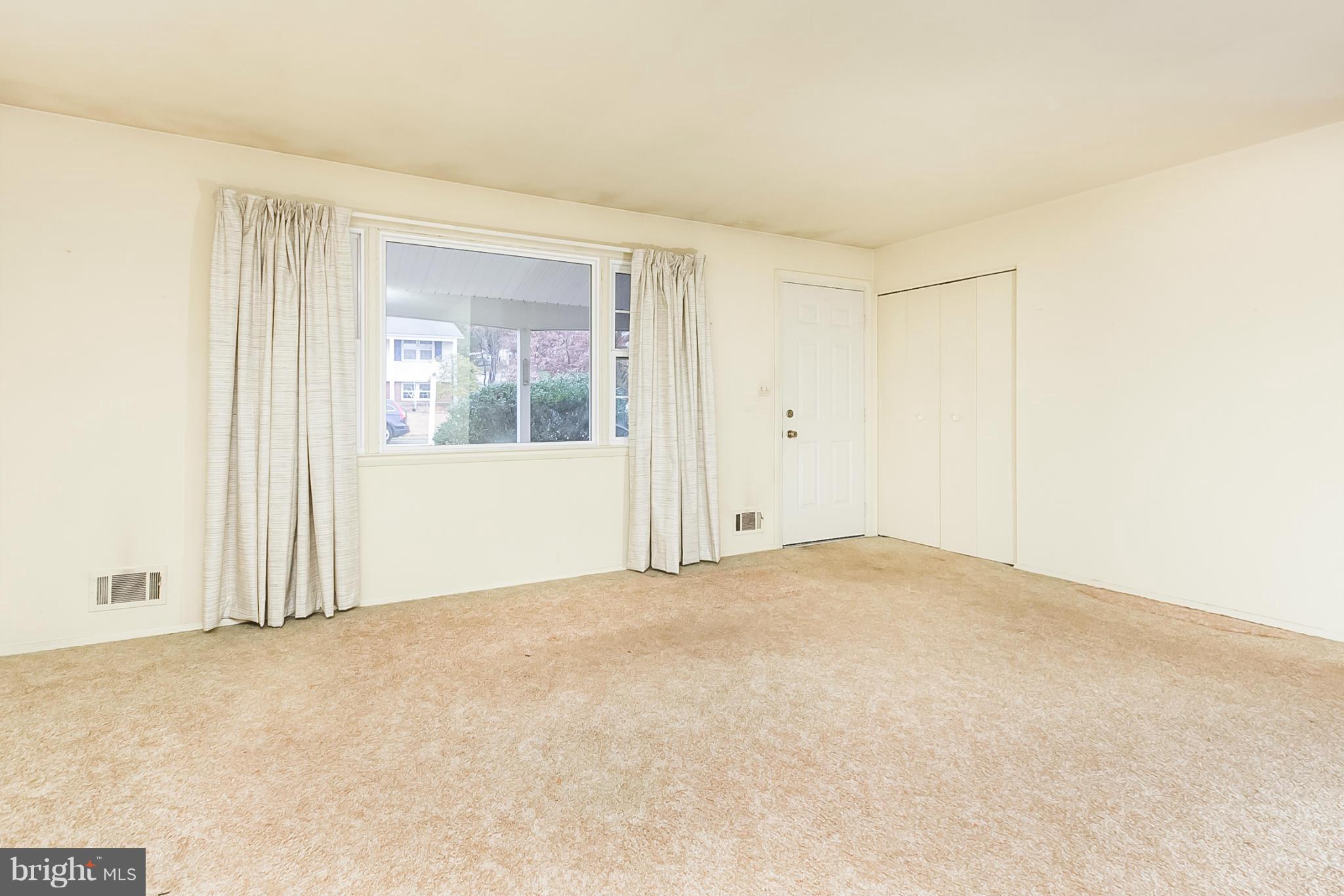 6738 Fordcrest Road Baltimore, MD 21237 - Photo 7 of 28 an empty room with windows