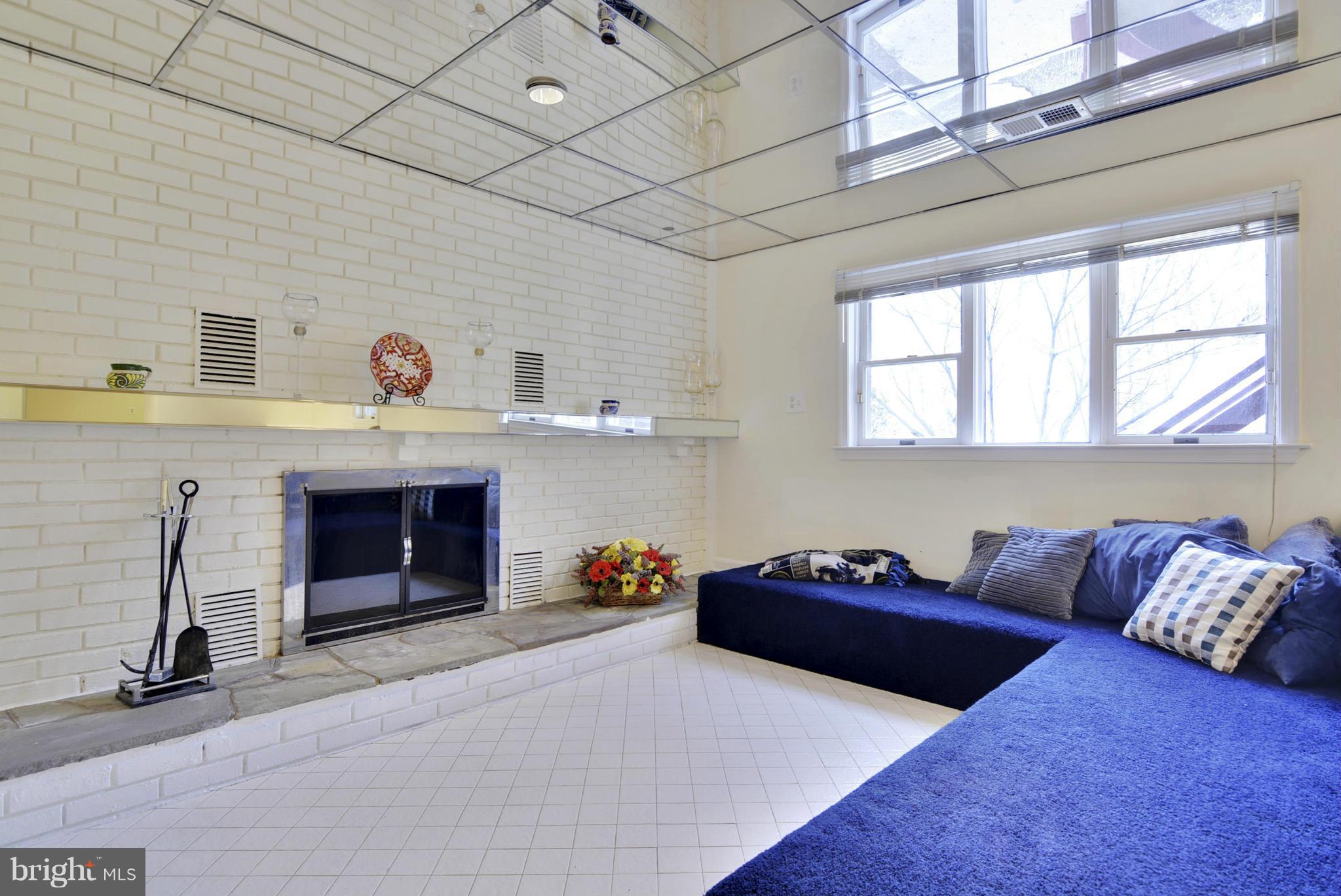 9 Redgate Court Silver Spring, MD 20905 - Photo 16 of 29 a living room with furniture and a fireplace