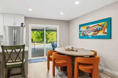 a dining room with furniture and window