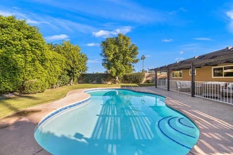 a view of a house with swimming pool