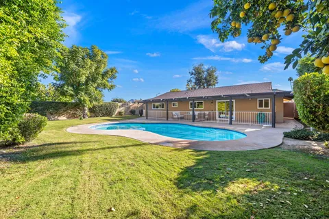 a view of a house with swimming pool