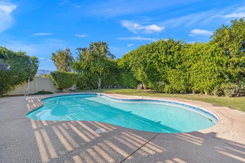 a view of a swimming pool with a patio