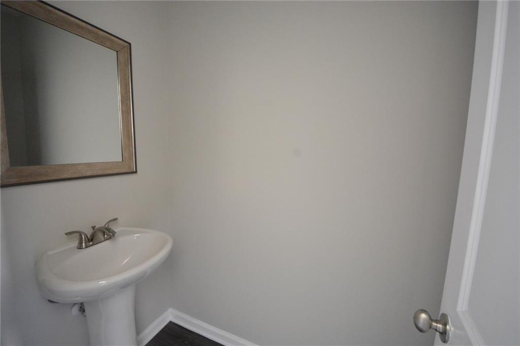 4722 Beacon Ridge Lane Flowery Branch, GA 30542 - Photo 12 of 24 a bathroom with a sink a mirror and vanity