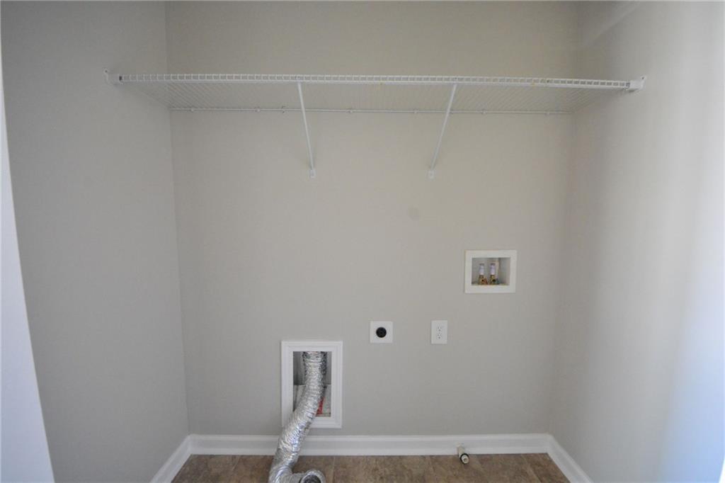 4722 Beacon Ridge Lane Flowery Branch, GA 30542 - Photo 18 of 24 a view of small space with racks on the wall