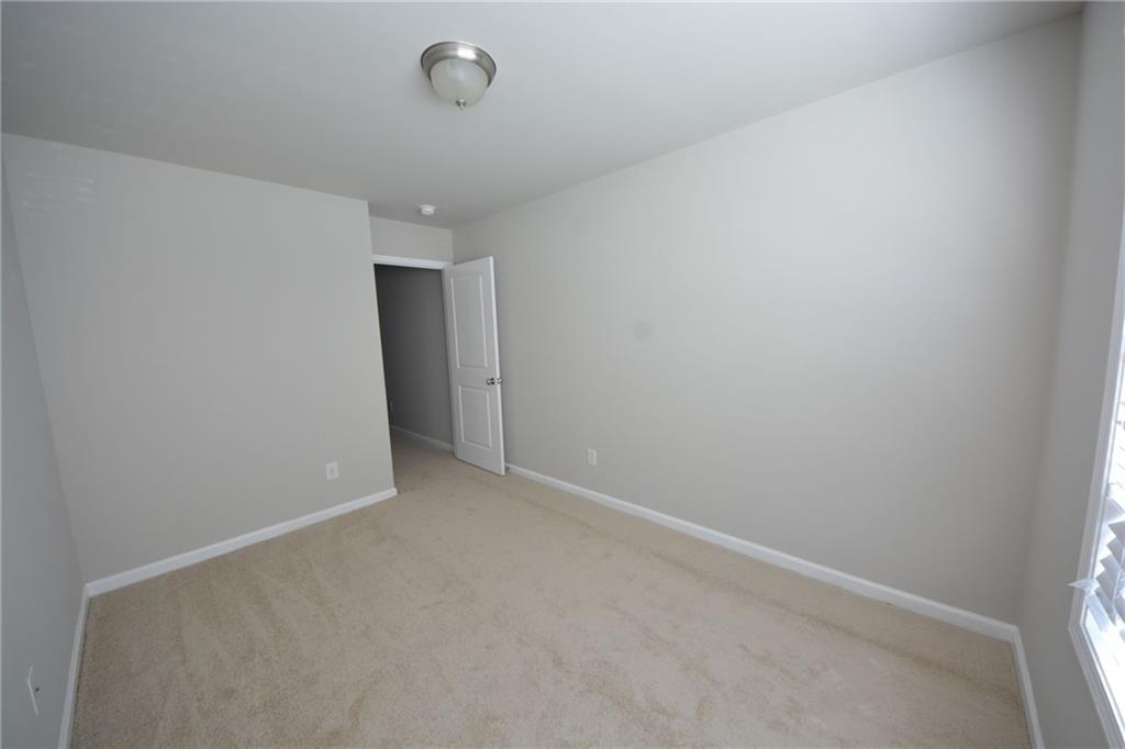 4722 Beacon Ridge Lane Flowery Branch, GA 30542 - Photo 20 of 24 a view of an empty room