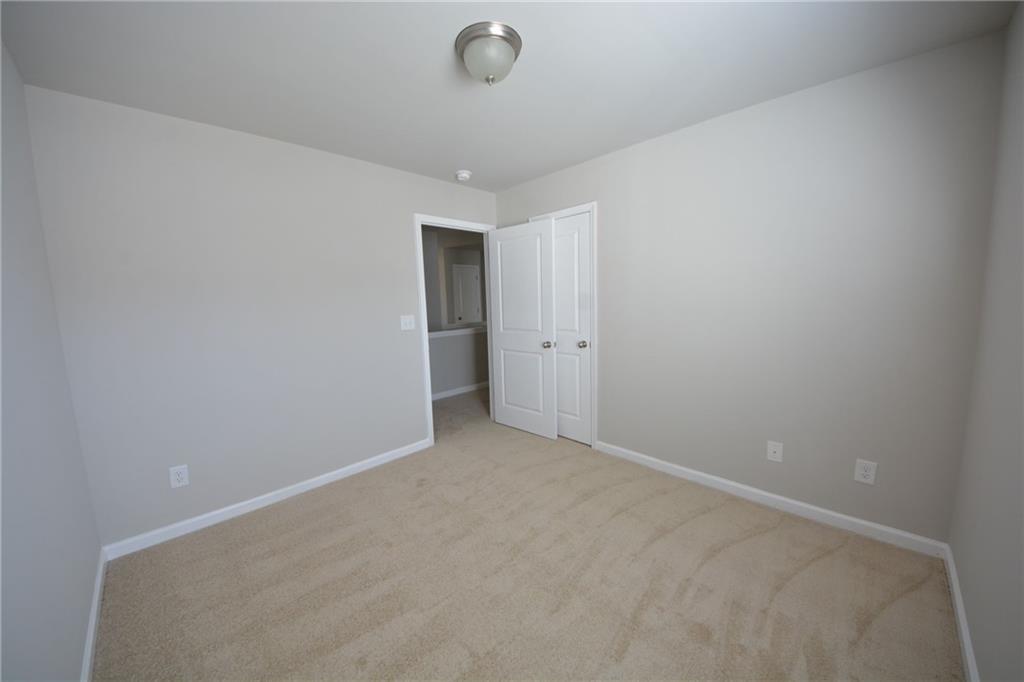 4722 Beacon Ridge Lane Flowery Branch, GA 30542 - Photo 23 of 24 a view of an empty room