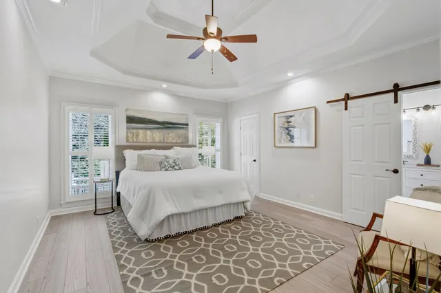 a bedroom with a bed furniture and a window