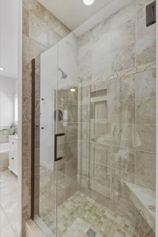 a bathroom with a shower and a sink