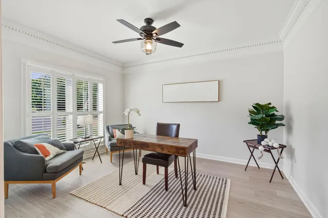 a work room with furniture and wooden floor