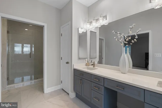 a bathroom with a double vanity sink and a mirror