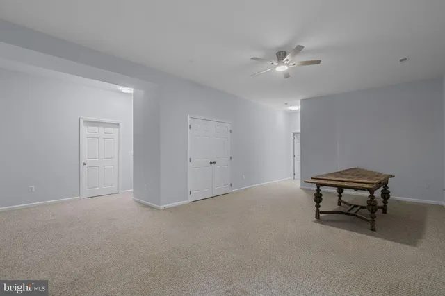 a view of livingroom with furniture and ceiling fan