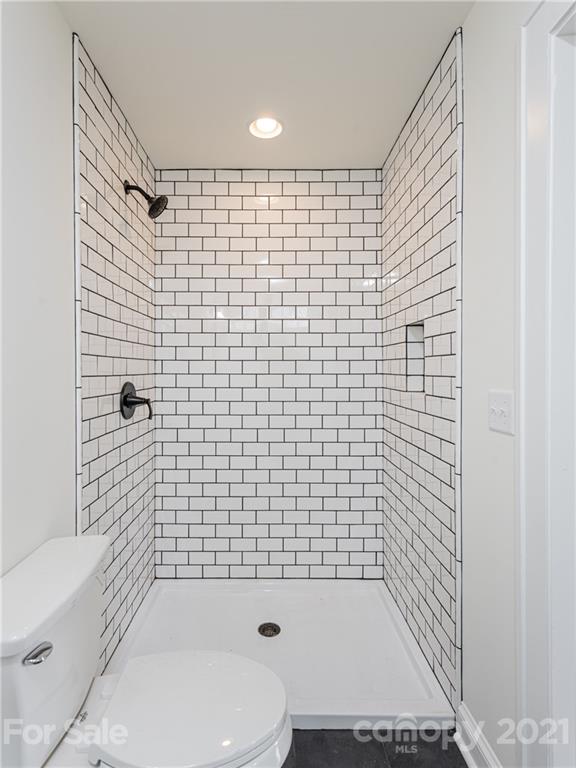 10 Souther Road, Unit 2 Fletcher, NC 28732 - Photo 15 of 38 a bathroom with a toilet and shower