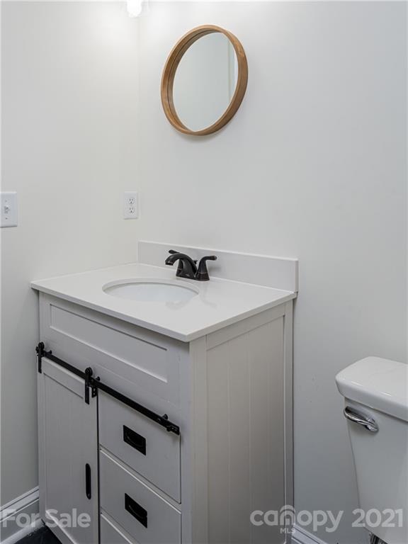 10 Souther Road, Unit 2 Fletcher, NC 28732 - Photo 23 of 38 a bathroom with a sink and a toilet