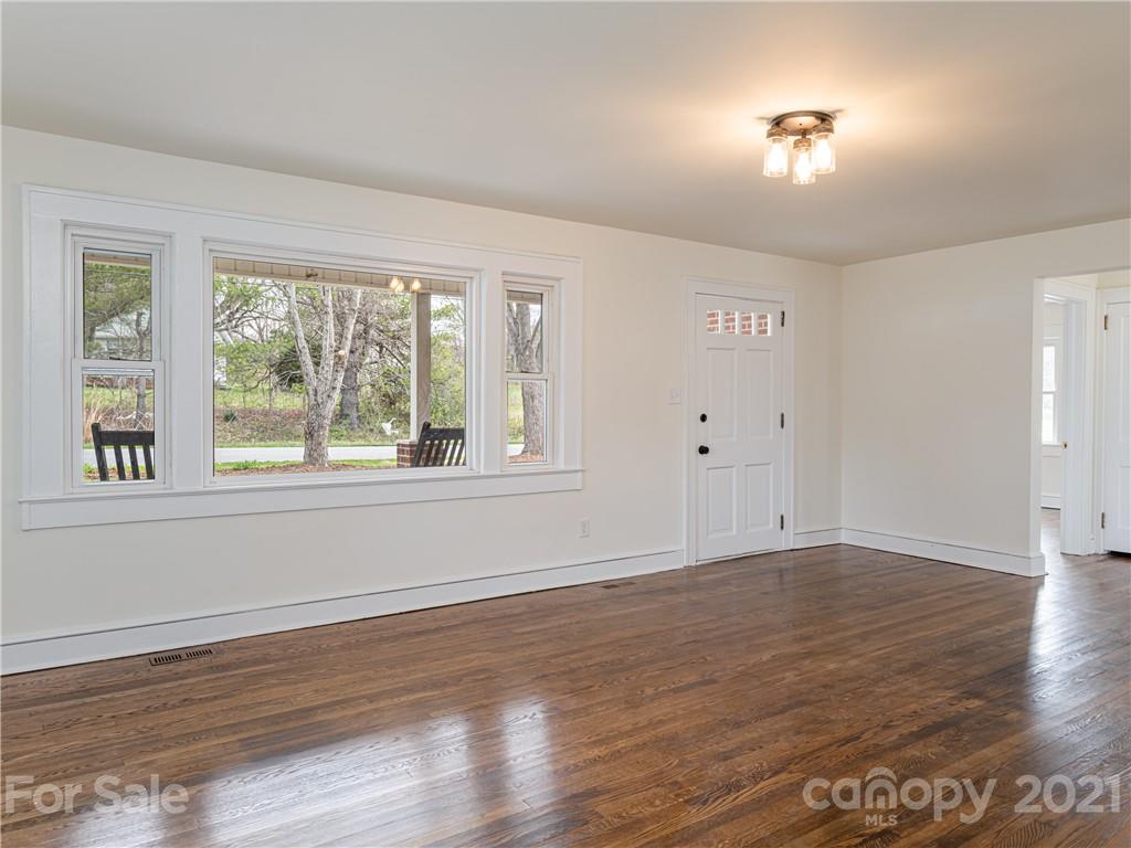10 Souther Road, Unit 2 Fletcher, NC 28732 - Photo 4 of 38 a view of an empty room with wooden floor and a window