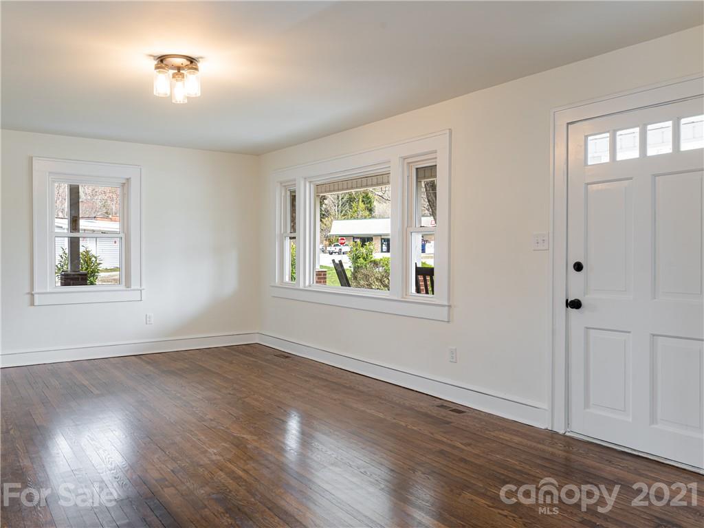 10 Souther Road, Unit 2 Fletcher, NC 28732 - Photo 6 of 38 a view of an empty room with wooden floor and a window