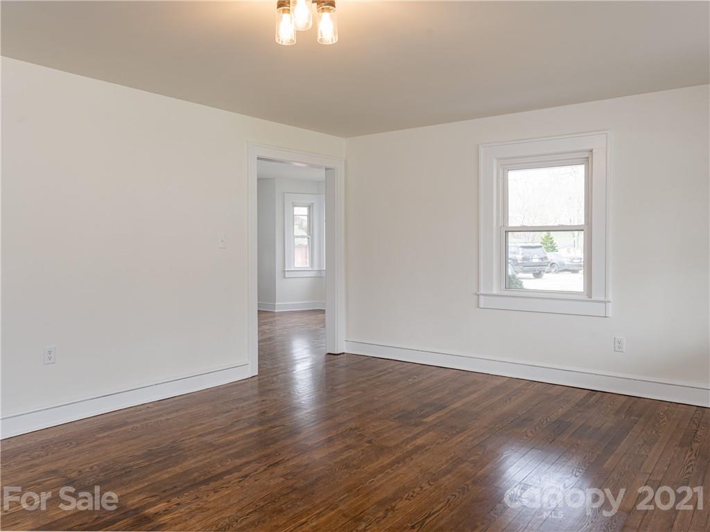 10 Souther Road, Unit 2 Fletcher, NC 28732 - Photo 7 of 38 a view of an empty room with wooden floor and a window