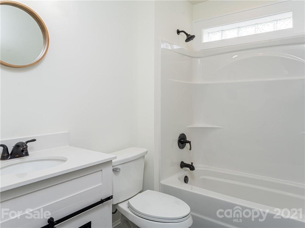 10 Souther Road, Unit 2 Fletcher, NC 28732 - Photo 10 of 38 a bathroom with a sink a toilet and shower