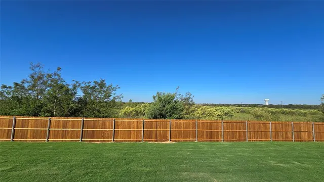 a view of a field with a yard