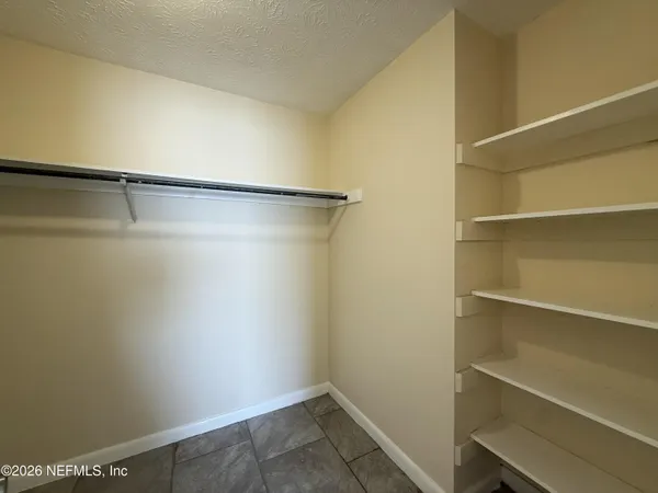 a view of an empty walk in closet