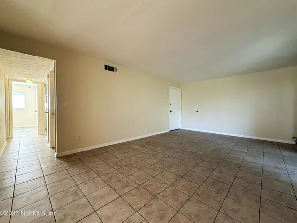 a view of an empty room and window