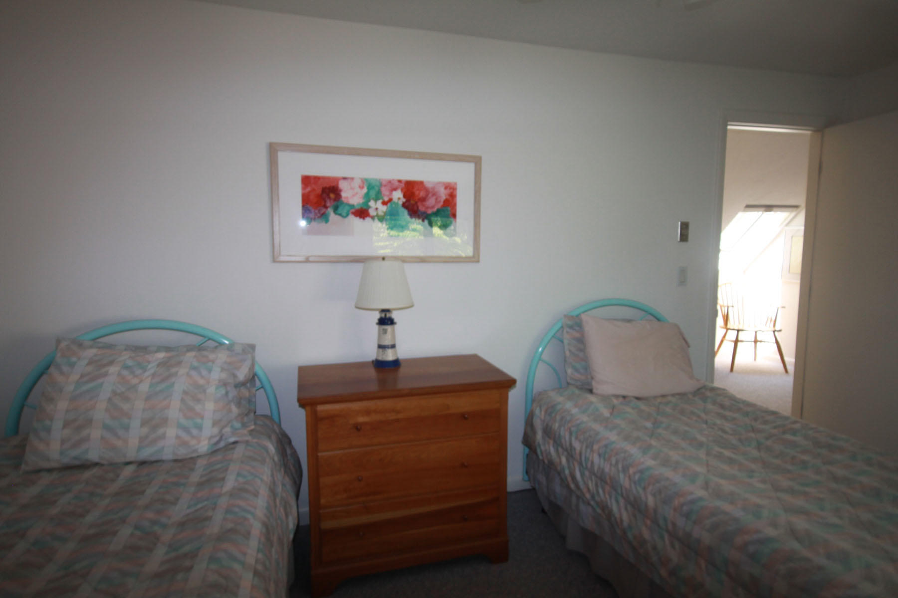 183 Fells Pond Road Mashpee, MA 02649 - Photo 15 of 19 a bedroom with a bed and a painting on the wall