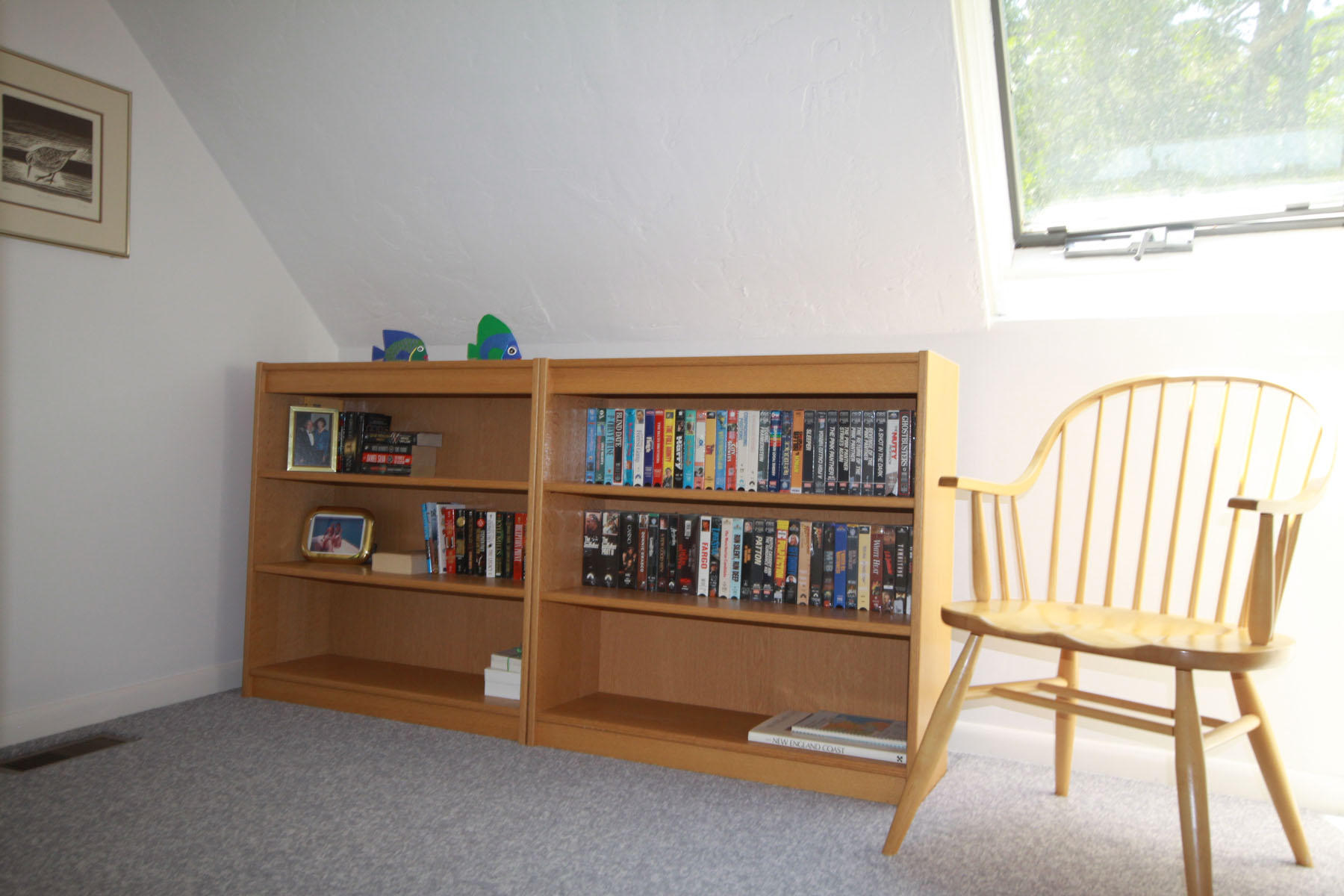 183 Fells Pond Road Mashpee, MA 02649 - Photo 10 of 19 a living room with fish tank and a bookshelf