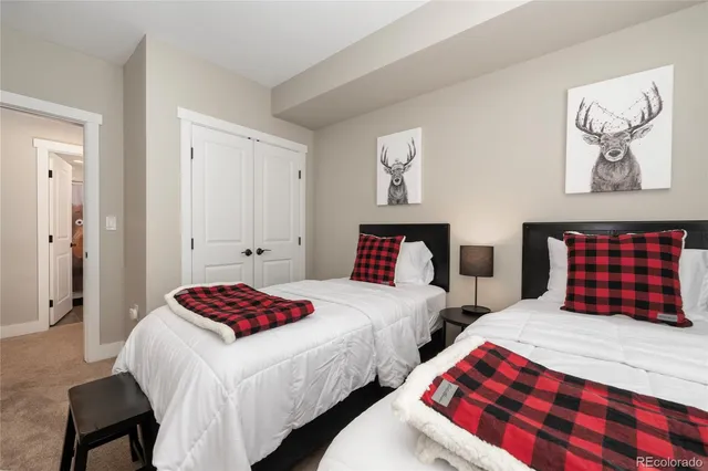 a living room with a black white checkered floor