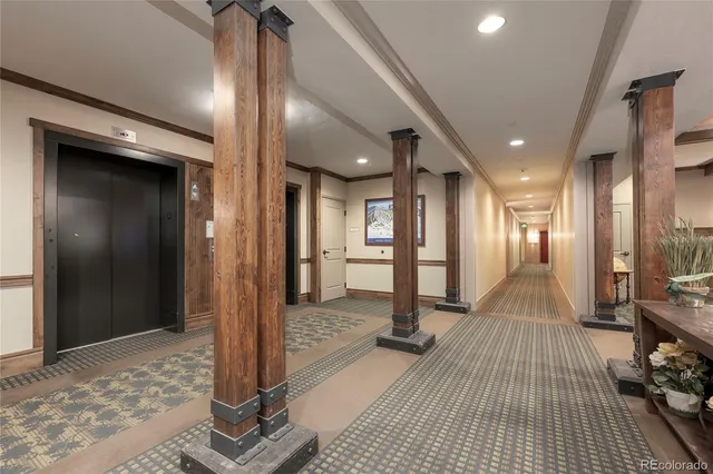 a view of a hallway with a livingroom