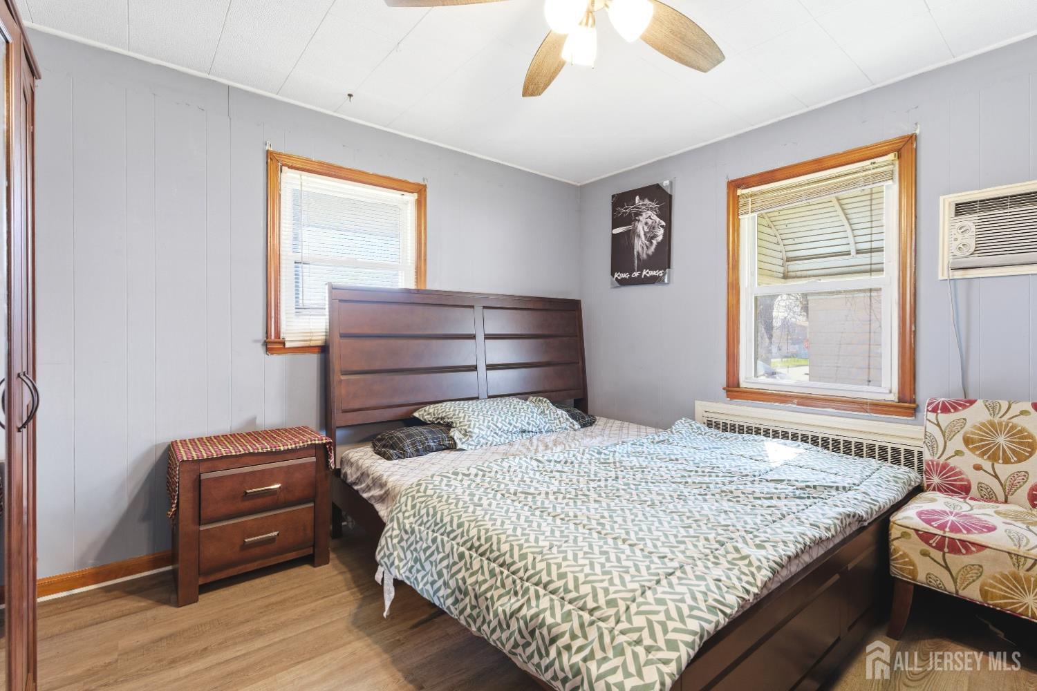 47 Spruce Street Port Reading, NJ 07064 - Photo 12 of 12 a bedroom with a bed and a window