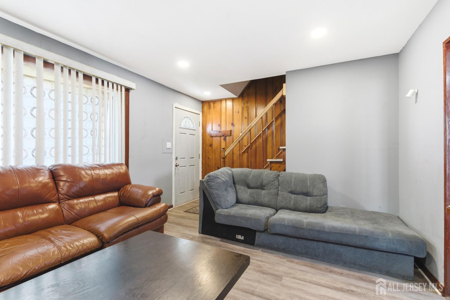47 Spruce Street Port Reading, NJ 07064 - Photo 3 of 12 a living room with furniture and a couch
