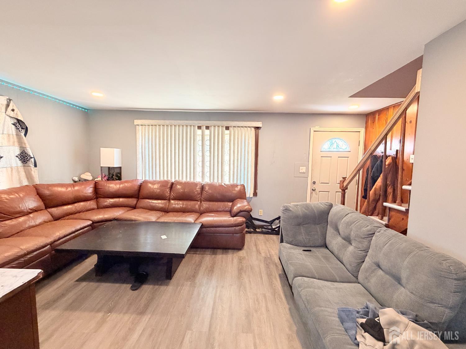47 Spruce Street Port Reading, NJ 07064 - Photo 4 of 12 a living room with furniture and a large window