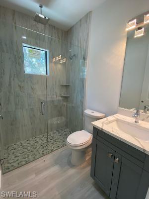 3651 29th Avenue Southwest Naples, FL 34117 - Photo 5 of 8 a bathroom with a granite countertop sink toilet and shower