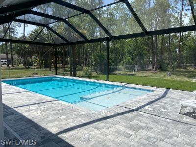 3651 29th Avenue Southwest Naples, FL 34117 - Photo 8 of 8 a view of a swimming pool with a backyard