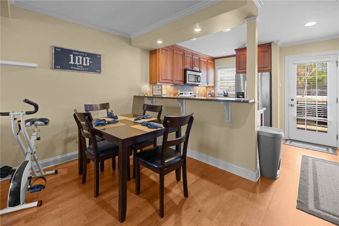 209 Calhoun Street, Unit 201 Clemson, SC 29631 - Photo 9 of 35 This bright kitchen and dining area offers functional design and seamless flow for daily living.