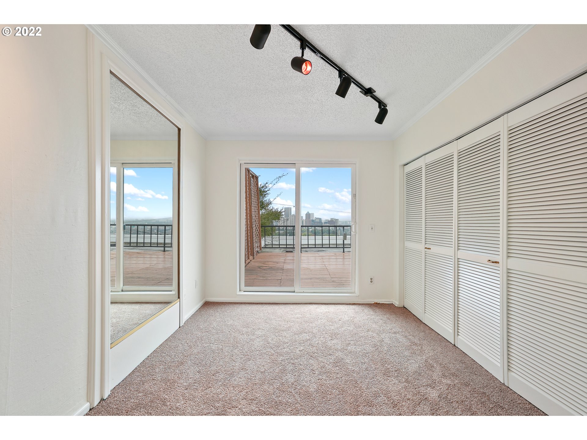 3701 Southwest Condor Avenue, Unit T3 Portland, OR 97239 - Photo 11 of 23 a view of an empty room with glass door