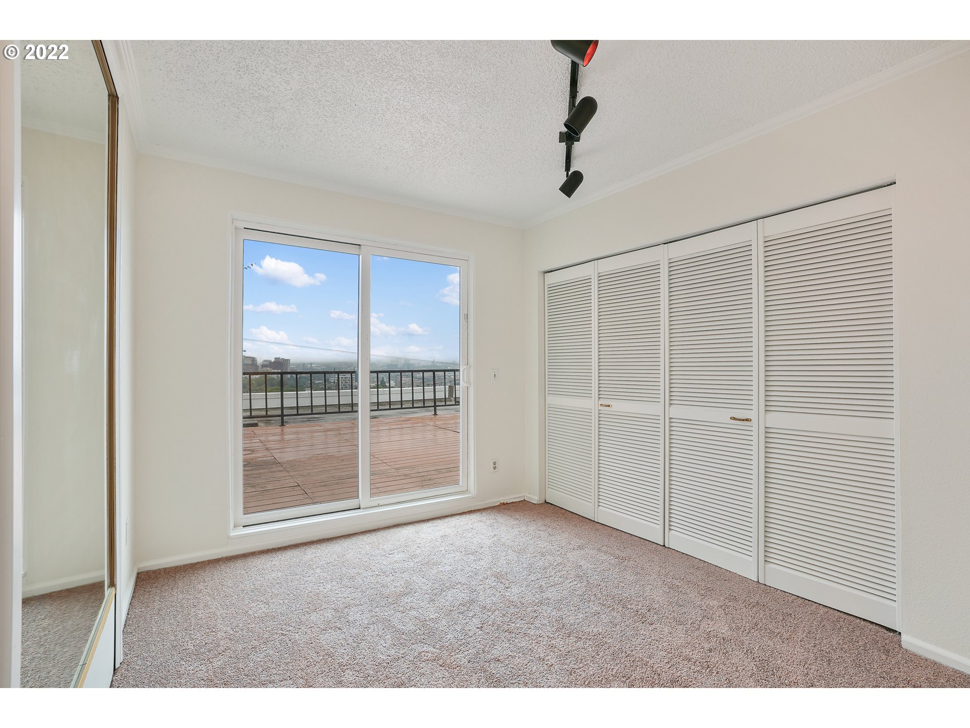 3701 Southwest Condor Avenue, Unit T3 Portland, OR 97239 - Photo 12 of 23 a view of an empty room with a window