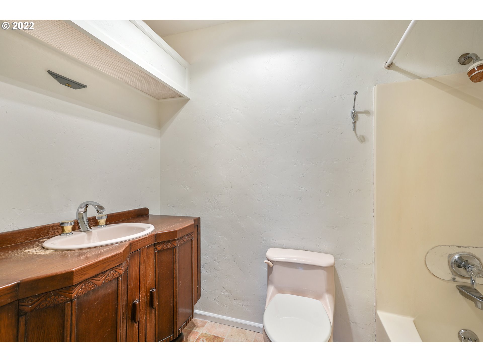 3701 Southwest Condor Avenue, Unit T3 Portland, OR 97239 - Photo 15 of 23 a bathroom with a sink a toilet and mirror