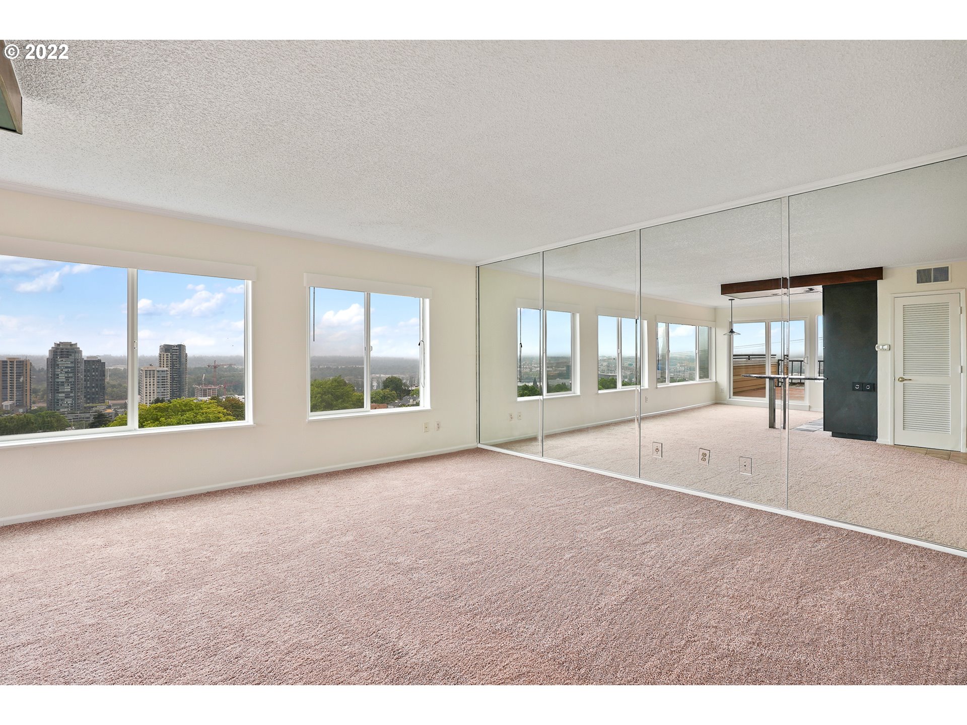 3701 Southwest Condor Avenue, Unit T3 Portland, OR 97239 - Photo 3 of 23 a view of an empty room with a window