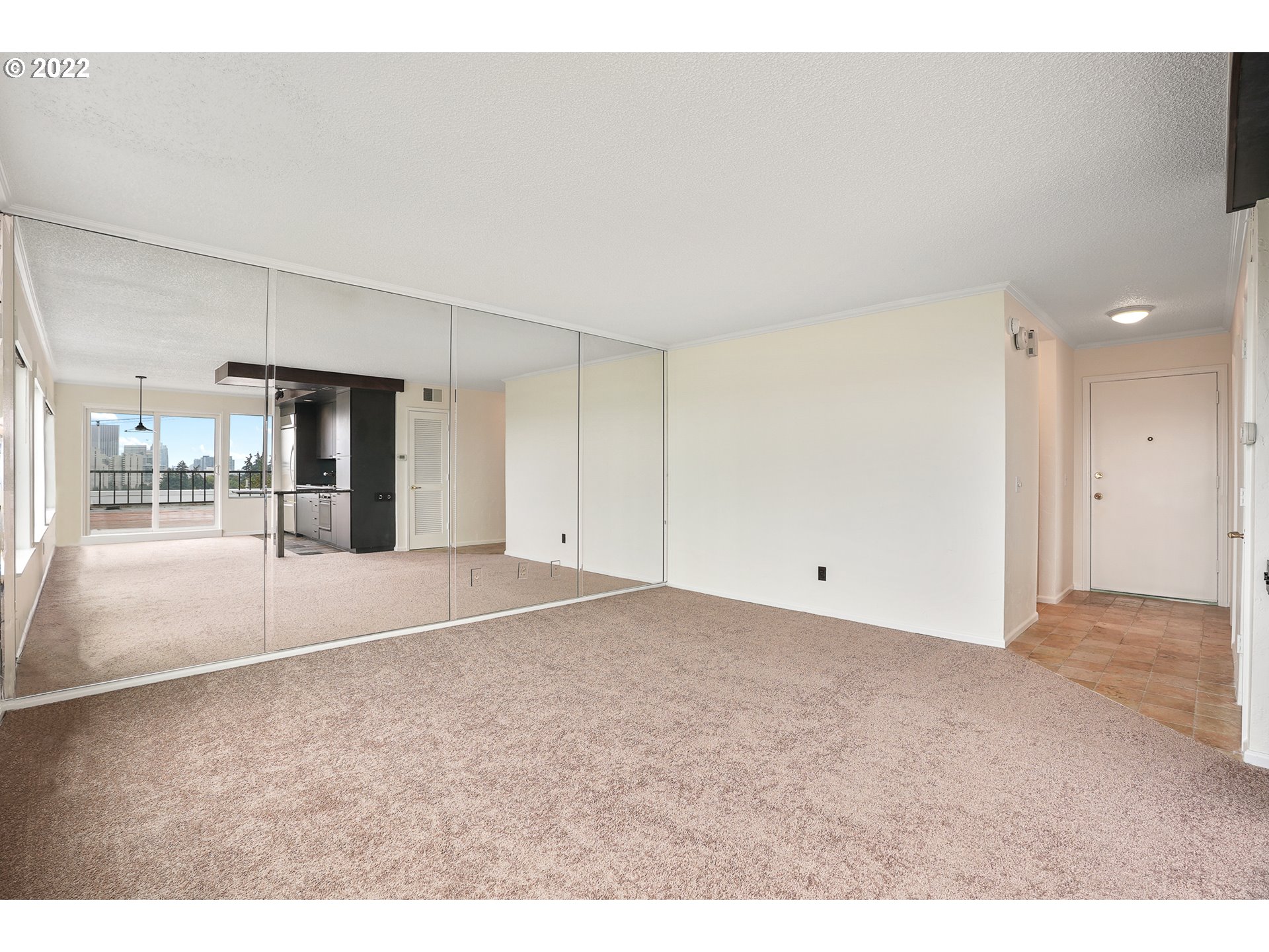 3701 Southwest Condor Avenue, Unit T3 Portland, OR 97239 - Photo 4 of 23 a view of an empty room with a window