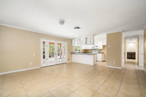 a view of kitchen with furniture and refrigerator