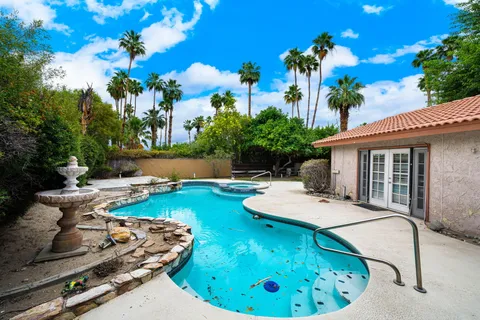 a view of a house with swimming pool