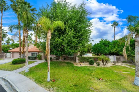 a backyard of a house with lots of green space