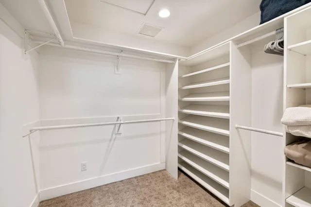 a bedroom with furniture and wooden floor